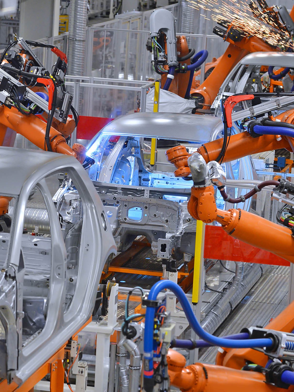 robots welding in an automobile factory 